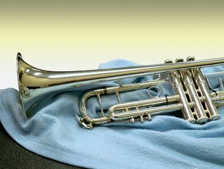 Trumpet posed on a blue cloth